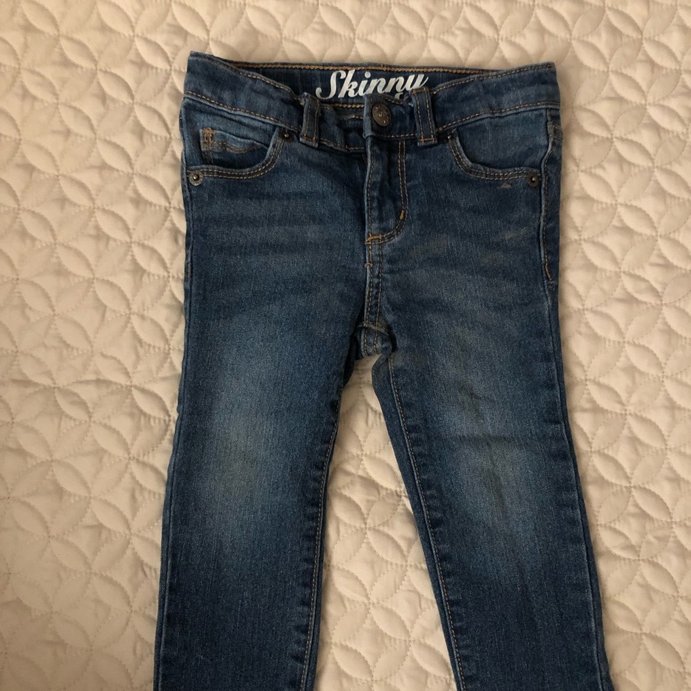 Medium wash toddler skinny jeans.